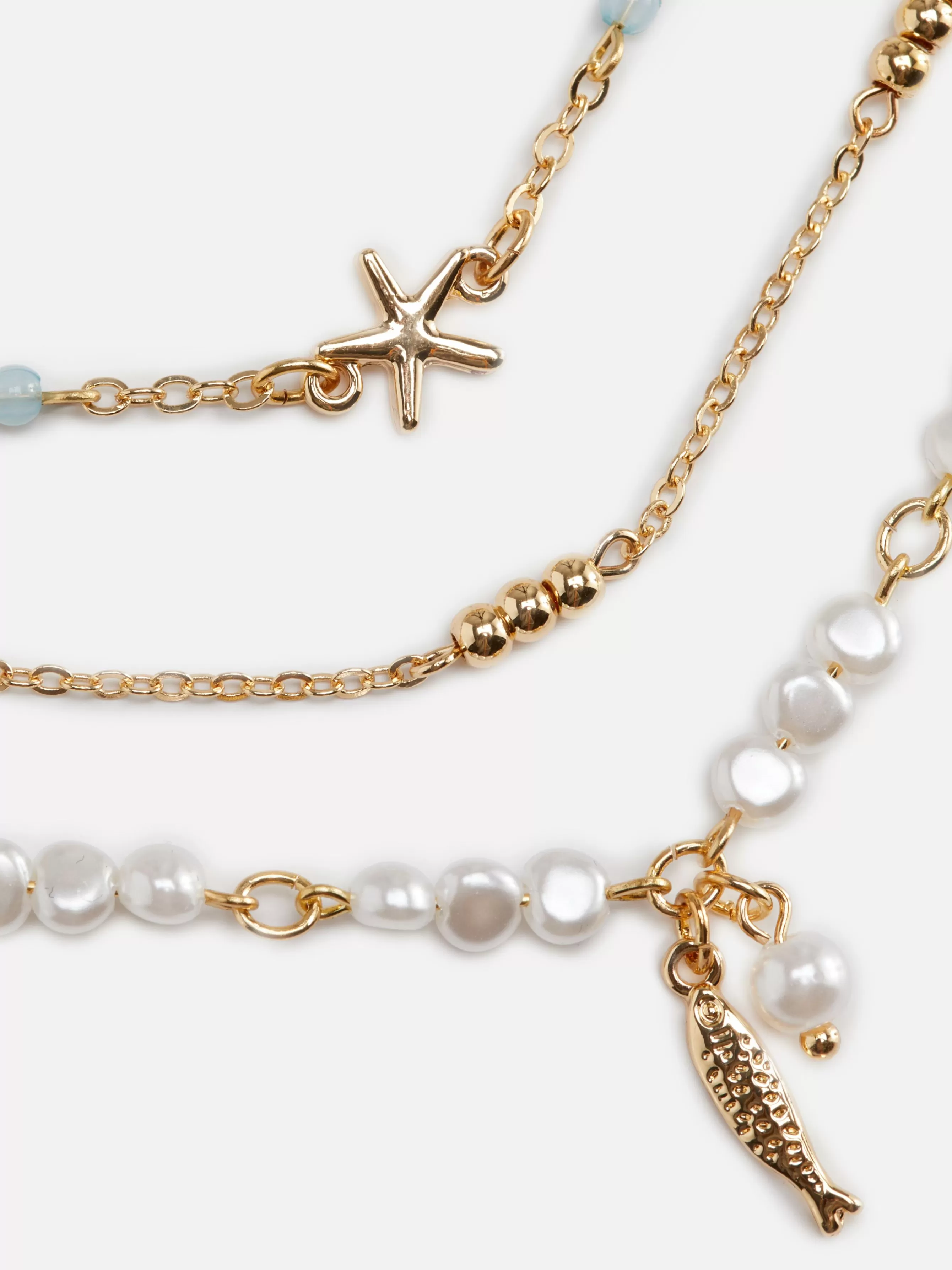 Shop Primark Lot De 3 Chaînes De Cheville à Motifs Bord De Mer Blanc